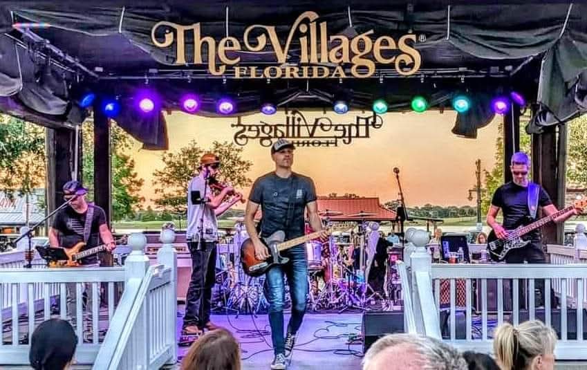 Greg Warren Band headlining at The Villages Florida outdoor stage at sunset